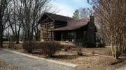The exterior of the Arbor Arch Cabin in Tennessee, as seen on HGTV's Log Cabin Living.