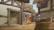 Zora und Albert stehen in einem dreckigen Dorf.