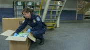 CBP Supervisor Grob inspects a package for contraband at the JFK mail facility.