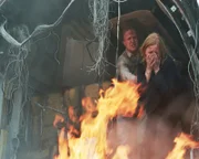 Two passengers (actors Tammy Fitzgerald and Jeremy Mitchell) attempt to flee the burning plane.