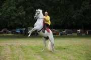 Karl Greenwood demonstrates how to stay on a bucking horse.