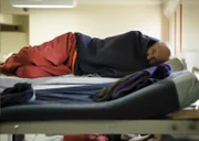 A prisoner lying in bed at Santa Rita Jail.