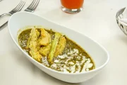 Callaloo, ein beliebter Gemüseeintopf, ist eine Mischung aus püriertem Taro-Grün, Okra, Kürbis, anderem Gemüse und frischer Kokosmilch, die hier im Restaurant „Chaud“ in Port of Spain, Trinidad und Tobago, serviert wird.