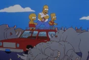Lisa, Homer (Mi.) und Bart freuen sich, dass die Rhinozerosse erledigt sind.