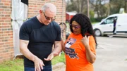 Chef Robert Irvine talks with Mavice Hughes, owner of Eddie's Restaurant, outside of the restaurant in Shreveport, LA, as seen on Restaurant: Impossible, Season 20.