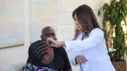 Dr. Sandra Lee feels the hidrocystomas on Ebonee P. left eye.