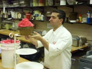 Buddy works on decorating a giant cupcake for Cupcake Day