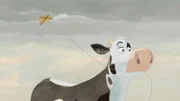 Lieselotte ist froh über den Wind, der ihren Drachen bis zu den Wolken trägt.