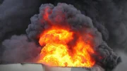 Flames and black smoke - air pollution concept.