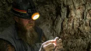 Rod Manning inspects opal