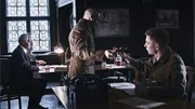 Drei Männer in einem Arbeitszimmer