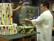 Buddy takes aim at the Paintball Cake , as seen in 'Cake Boss' series 3 featured in 311.
