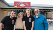 The Spragg family. Mike (son/chef), Carin (owner/Greg's wife), Victoria (daughter/server), and Greg (owner) stand outside of Greg's BBQ in Belen, NM, as seen on Restaurant: Impossible, Season 20.