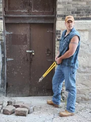 Mark prepares to cut the lock to an abandoned Pabst Brewery building.