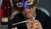 BANGKOK- Stripper 'Aei' smokes crystal meth through a water pipe.