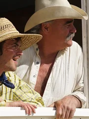 Jonathan Kondor and Marty Raney at the window inside the storage container at Kondors Homestead in Lovelock, Nevada.