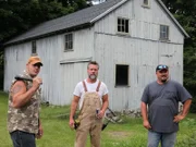 Jay, Mark and Dan stand outside of the white Amaral barn thinking about what he wants to purchase.