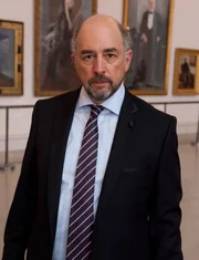 Strombroker Andrew Stanzler (Richard Schiff)