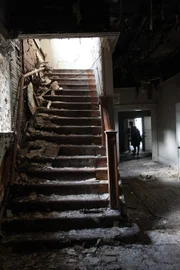Hot Springs, AR USA: The collapsed wall and Stairwell at the Majestic Hotel. Way in the background is producer Stacie L Nice and A1 Travis Breitenbach.