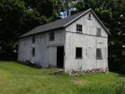 A view of on the of white Amaral Barns.