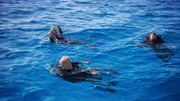 Darrell Miklos, Jim Sinclair, and Eric Schmitt in water.