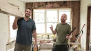 Keith Bynum and Evan Thomas pose while framing the living room, as seen on Bargain Block, Season 3.