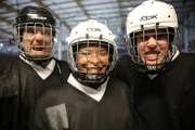 MANCHESTER, UNITED KINGDOM - Paul, Marcia and Alejandro wearing their ice hockey kit after Demo 4. The volunteers have just taken part in a demonstration looking at the expanding universe. They have worked with an ice hockey team, leaf blowers and balloons to figure this challenge out.