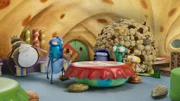 Floyd (2.v.r.), Abakus (3.v.r.) und PB (r.) sind mit dem großen Krümelball im Pfannkuchen-Restaurant. Hier können sie sich damit alles kaufen, was sie möchten. Doch Martine (2.v. l.) ist von Floyds Feilschereien nicht begeistert.