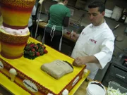 Buddy adds coffee beans to the HD Cake