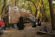 Drum kit and amps surround the stage as the Brother Short Band prepares for an open house party for the tiny house as seen on Tiny House, Big Living.