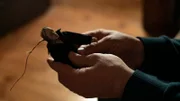 Close up: Monty holds the creepy doll.