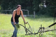 Antonia working on the field with the horse