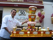 Buddy poses with the completed HD Cake at the store
