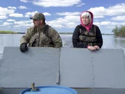Charlie Wright (L) and daughter Teneisha (R) head out on the boat.