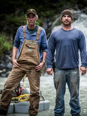 Wes Richardson and Dustin Hurt stood in the creek.