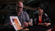 Dave Schrader is with Cindy Kaza as he presents a photograph of the bite mark he sustained during the investigation of the USS Constellation in Baltimore, MD, as seen on Travel Channel's The Holzer Files