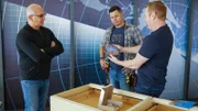Chef Robert Irvine discusses with the design team, Tom Bury and Lynn Kegan, how the construction and redesign is coming along, as seen on Restaurant Impossible, season 20