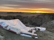The dig site covered up to keep it warm and dry.