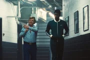 l-r: John C. Reilly as Dr. Jerry Buss, Quincy Isaiah as Magic Johnson