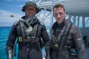 Survivors Paul de Gelder and James Glancy about to enter the water and spend 48 hours with sharks.