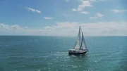 A sailboat is on the water.