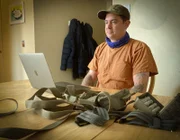 Lucas 'Chuke' Rowley, by a laptop as he examines evidence from Alaska