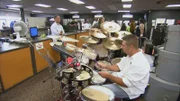 Playing drums.