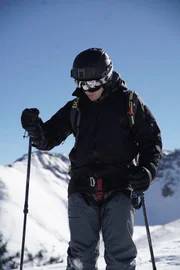 Tim Kennedy gets his skis on as he prepares to ski cut an unstable slope to trigger an avalanche.