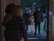 Blanche getting escorted away by police, daughter watch on.