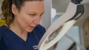 Close Up of Dr Emma looking through exam mirror