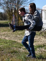 JULIA piggyback on BRANDON at the farm.