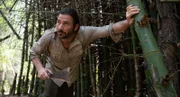 Hazen Audel cuts his way through a bamboo forest in Thailand.