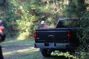 Warden Morgan Inman near truck
