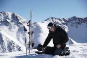 Tim Kennedy gets ready to ski down an unstable slope to try and trigger an avalanche.